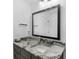 Bathroom with granite countertop, framed mirror and modern fixtures at 2775 Club Valley Ct, Jonesboro, GA 30236