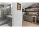 Bathroom and bar with tiled shower and stocked liquor shelves at 2775 Club Valley Ct, Jonesboro, GA 30236