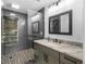 Modern bathroom with granite countertop and tiled shower with glass partition at 2775 Club Valley Ct, Jonesboro, GA 30236