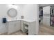 Elegant bathroom featuring a stylish vanity, modern fixtures, and adjacent closet at 2775 Club Valley Ct, Jonesboro, GA 30236