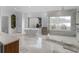 Elegant bathroom features a glass enclosed shower, soaking tub, and marble flooring at 2775 Club Valley Ct, Jonesboro, GA 30236