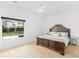 This bedroom features a large window and hardwood floors at 2775 Club Valley Ct, Jonesboro, GA 30236