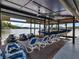 Covered boat dock with boat, jet skis, and seating featuring serene lake view at 2775 Club Valley Ct, Jonesboro, GA 30236