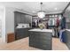 This walk-in closet features custom storage and a chandelier at 2775 Club Valley Ct, Jonesboro, GA 30236
