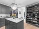 This walk-in closet features custom storage and a chandelier at 2775 Club Valley Ct, Jonesboro, GA 30236