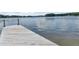 Waterfront view from the end of the private wooden dock, offering peaceful lake access and recreation at 2775 Club Valley Ct, Jonesboro, GA 30236