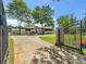 Gated entrance to a private estate with manicured lawns and an elegant home in the background at 2775 Club Valley Ct, Jonesboro, GA 30236