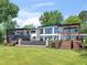 Modern two-story home showcasing outdoor living spaces and a lush green lawn at 2775 Club Valley Ct, Jonesboro, GA 30236