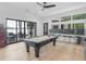 Game room with lake views, pool table, wet bar, and easy access to the patio at 2775 Club Valley Ct, Jonesboro, GA 30236