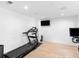 Spacious workout room with a large window, treadmill, and stationary bike at 2775 Club Valley Ct, Jonesboro, GA 30236