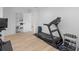 Home gym with storage and equipment, including a treadmill and free weights at 2775 Club Valley Ct, Jonesboro, GA 30236