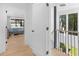 Bright hallway with hardwood floors, modern lighting, and a glimpse of the lake view bedroom at 2775 Club Valley Ct, Jonesboro, GA 30236