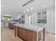 Modern kitchen features a marble-top island, stainless steel appliances, and hardwood floors at 2775 Club Valley Ct, Jonesboro, GA 30236