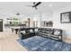Spacious living room featuring a sectional sofa, modern accents, and ample seating at 2775 Club Valley Ct, Jonesboro, GA 30236
