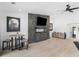 Open living area with modern fireplace, hardwood floors, and stylish decor at 2775 Club Valley Ct, Jonesboro, GA 30236