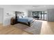 Tranquil main bedroom offers deck access with lake views and natural light at 2775 Club Valley Ct, Jonesboro, GA 30236