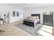 Spacious main bedroom with hardwood floors, dresser, and a view to the en-suite bathroom at 2775 Club Valley Ct, Jonesboro, GA 30236