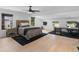 Spacious main bedroom with light wood flooring, ceiling fan and office area at 2775 Club Valley Ct, Jonesboro, GA 30236