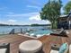 Backyard pool and lounge area with stunning lake views, perfect for relaxing and enjoying the outdoors at 2775 Club Valley Ct, Jonesboro, GA 30236