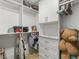 Well-organized walk-in closet with shelving, drawers, hanging rods and great organization at 2775 Club Valley Ct, Jonesboro, GA 30236