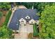 Overhead shot of an elegant home with manicured landscaping, driveway, and backyard pool at 2885 Coles Way, Atlanta, GA 30350