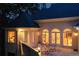 Backyard patio with seating, arched windows, and well-manicured landscaping, perfect for outdoor living and entertaining at 2885 Coles Way, Atlanta, GA 30350