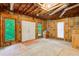 Unfinished basement with exposed wood framing, large windows, and ample space at 2885 Coles Way, Atlanta, GA 30350