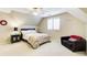 Cozy bedroom featuring neutral color palette and comfortable furnishings under an angled ceiling at 2885 Coles Way, Atlanta, GA 30350