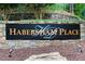 Elegant Habersham Place community sign set in a stone structure with manicured landscaping at 2885 Coles Way, Atlanta, GA 30350