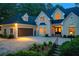 Elegant home with a manicured front yard, inviting entrance, and warm exterior lighting, perfect for curb appeal at 2885 Coles Way, Atlanta, GA 30350