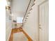 Traditional style hallway with hardwood floors, white walls, and staircase at 2885 Coles Way, Atlanta, GA 30350