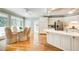 Gourmet kitchen featuring hardwood floors, white cabinets, and large windows at 2885 Coles Way, Atlanta, GA 30350