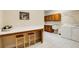 Spacious laundry room featuring tile floor, desk and sink at 2885 Coles Way, Atlanta, GA 30350