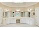 Large main bathroom with double vanities and arched windows at 2885 Coles Way, Atlanta, GA 30350