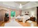 Bright main bedroom with hardwood floors, tray ceilings, and large windows at 2885 Coles Way, Atlanta, GA 30350