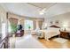 Bright main bedroom with hardwood floors, tray ceilings, and large windows at 2885 Coles Way, Atlanta, GA 30350