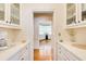 Pantry has white cabinets, hardwood floors, and lots of counter space at 2885 Coles Way, Atlanta, GA 30350