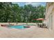 Outdoor pool area with a seating area, and well-manicured landscaping at 2885 Coles Way, Atlanta, GA 30350