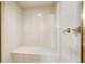 Shower area with a built-in seat and marble-look walls at 2885 Coles Way, Atlanta, GA 30350
