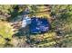 Aerial view of the home showcasing the roof, driveway, and surrounding trees at 374 Lamancha Ct, Lawrenceville, GA 30044