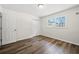 Bright bedroom with hardwood floors, a double window, and neutral wall color at 374 Lamancha Ct, Lawrenceville, GA 30044