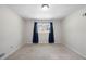 Bedroom featuring neutral carpet and a window with curtains at 374 Lamancha Ct, Lawrenceville, GA 30044