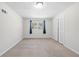 Neutral bedroom with window and bi-fold closet doors at 374 Lamancha Ct, Lawrenceville, GA 30044