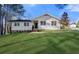 Charming home with a stone foundation, welcoming entrance, and well-maintained lawn at 374 Lamancha Ct, Lawrenceville, GA 30044