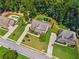 Aerial view of a neighborhood showcasing well-maintained homes, lush greenery, and manicured lawns at 1344 Hamilton Creek Nw Dr, Kennesaw, GA 30152