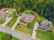 Aerial view of a neighborhood with mature trees, manicured lawns, and a swimming pool at 1344 Hamilton Creek Nw Dr, Kennesaw, GA 30152