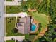 Aerial view of a house, a pool, large lawn, and driveway at 1344 Hamilton Creek Nw Dr, Kennesaw, GA 30152