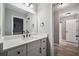 Bathroom with white vanity, black faucet, and an open doorway to the shower at 1344 Hamilton Creek Nw Dr, Kennesaw, GA 30152