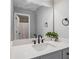Bathroom with quartz countertop vanity, black hardware, and framed mirror at 1344 Hamilton Creek Nw Dr, Kennesaw, GA 30152