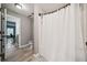 Bathroom showing an open doorway to a shower and the floor plan to the neighboring room at 1344 Hamilton Creek Nw Dr, Kennesaw, GA 30152